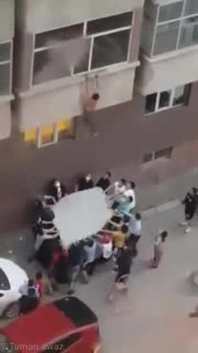 Group saves a man from burning apartment.