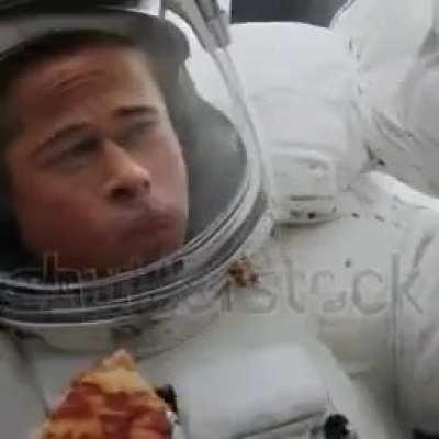 Brad Pitt eating pizza in space