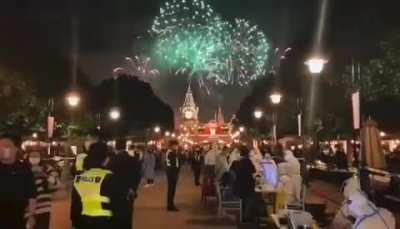 Shanghai's Disneyland castle's fireworks show playing during a sudden COVID lockdown