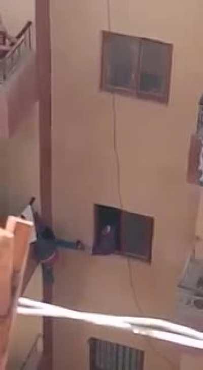 An Egyptian mother almost making her kid fall to his death trying to retrieve the house keys he forgot inside