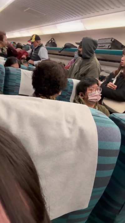 Young man nearly kisses elder in Taiwan train seat dispute