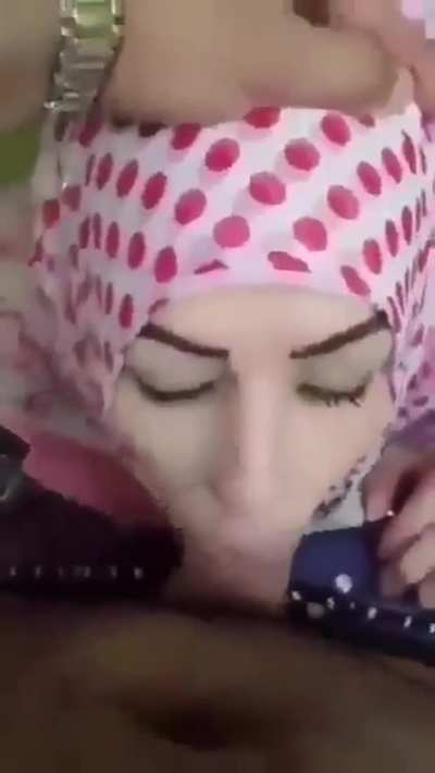 Hijabi Muslim woman on her knees doing her favourite job 