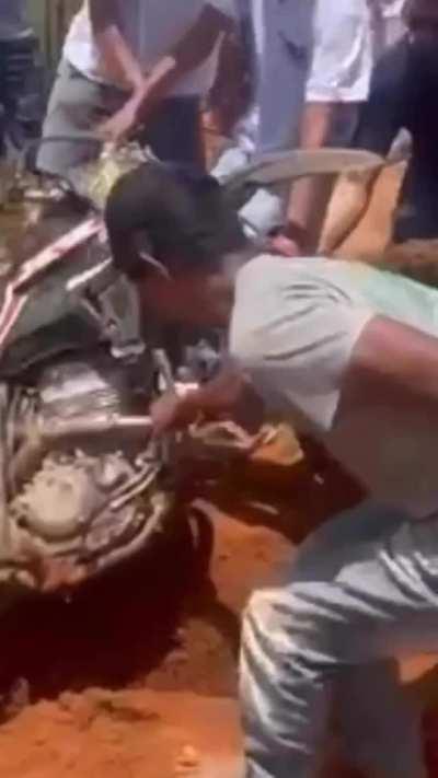 Helping to pull the bike