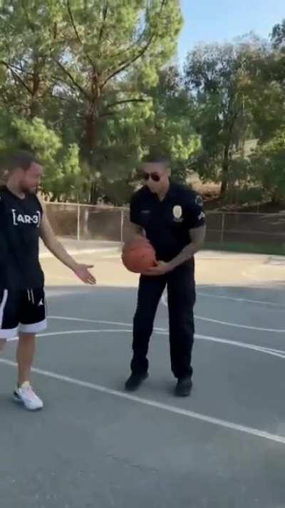 The Man doesn't know the cop is a basketball player