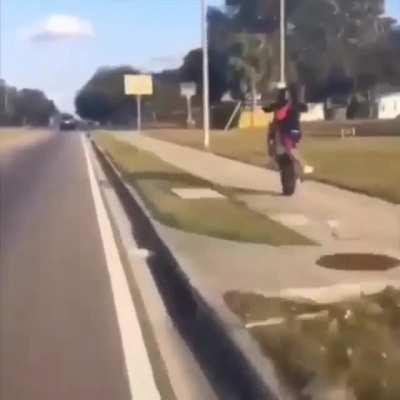 Messing about pulling wheelies on the road and pavement, wraps bike around lamppost