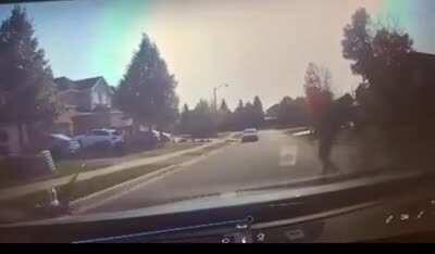 A man pushes his own child into a moving car in Missisauga, CA to apparently “prove a point” that pedestrians have the right of way on residential streets.