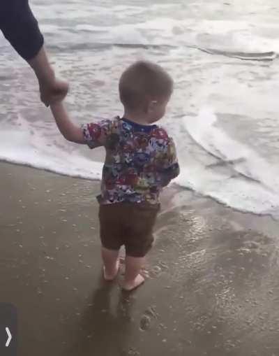 His first time at the beach