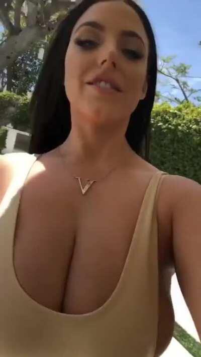 Angela walks for us again. Her top can hardly hold her breasts in.