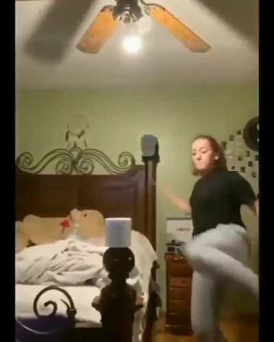 Trying to kick a roll of toilet paper