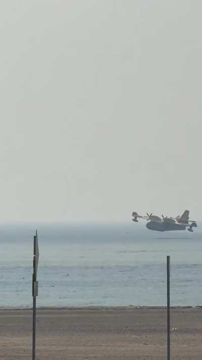 Amphibious 'Super Scooper' airplanes from Quebec, Canada are picking up seawater from the Santa Monica Bay to drop on the Palisades Fire.