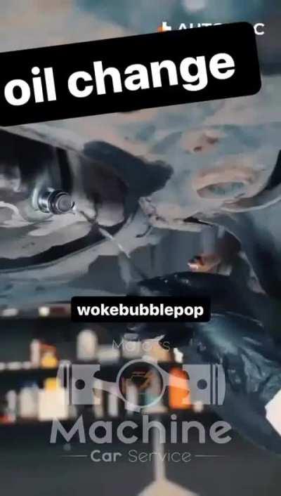 Men changing the oil - SFW