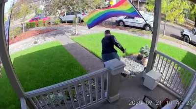 Delivery driver freaks out after a pride flag brushes against his arm