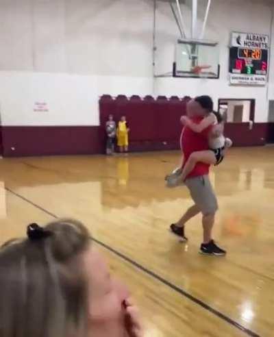 She scored her first basket and then ran to her dad to give him a hug!