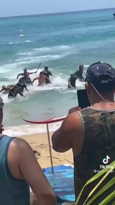 Dominicans arriving by boat on a beach in Puerto Rico