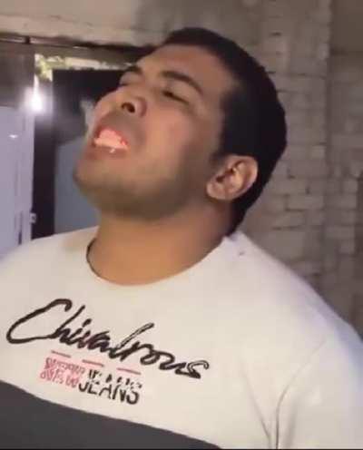 Guy eats burning coal