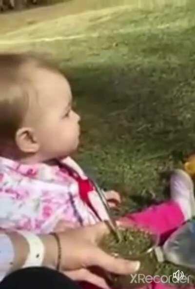 Baby tries herbal tea for the first time