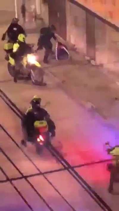Police attack a passing man. Siloé, Cali. May 4th 2021.