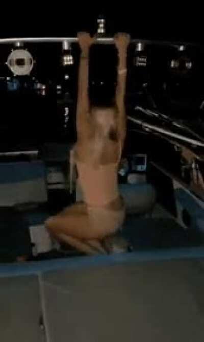 woman do backflip on boat
