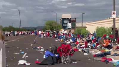 Outside the stadium entrance for Charlie Kirk's memorial, followers quickly transformed clean streets into a trash-filled zone with constant medical emergencies