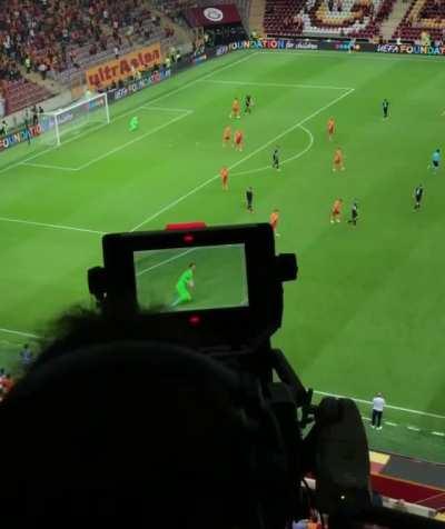 Camera operator following gameplay at professional soccer league match