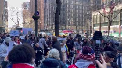A medical freedom rally is taking place outside of Pfizer World Headquarters in New York City
