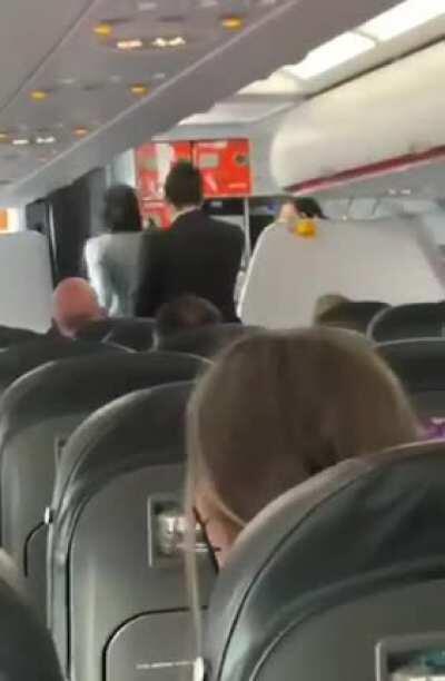 Lady goes crazy after being kicked off the plane for not wearing a mask, this happened on a flight from Belfast to Edinburgh