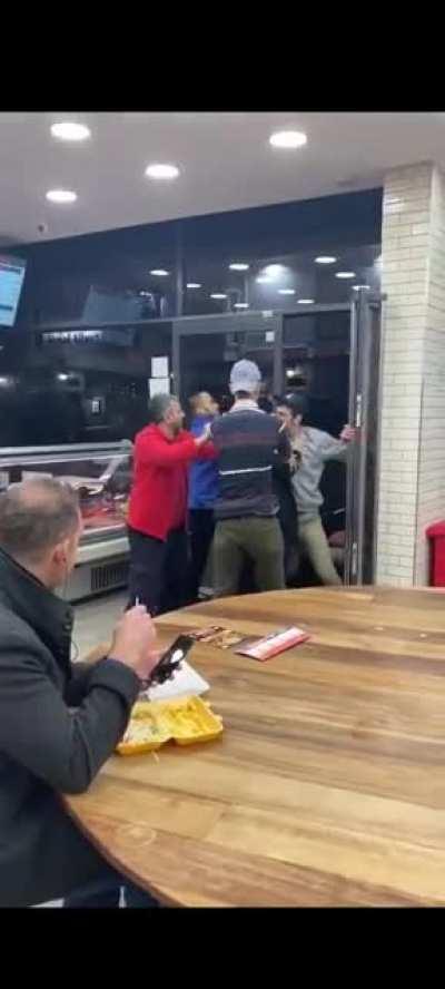 Guy eating is definition of minding own business