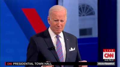 Joe Biden is standing on an invisible podium? Ready to fight? Flying a jetpack? What is your theory?