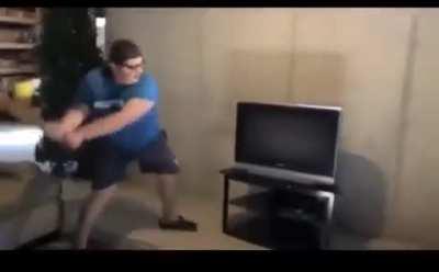 Ungrateful kid smashes tv with a bat