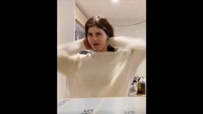 Clip of Alexandra Daddario changing shirts in background of YT video