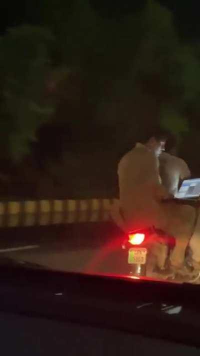 take a guess. Working remotely or talking to his girl?