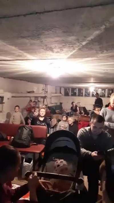 A girl sing a song in a shelter