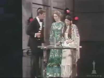 Crowd boos Native American sent by Marlon Brando who refused to accept his Oscar for Godfather due to Hollywood's treatment of American Indians