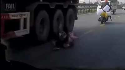Driver bumps motorcycle with child, and it almost gets worse.