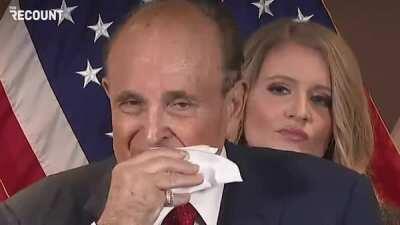 Rudy Giuliani wiping off hair dye sweat