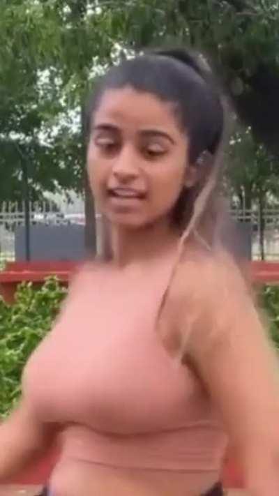 Flaunting her huge natural titties