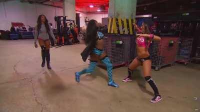 Naomi practicing low blows on Nikki Bella backstage