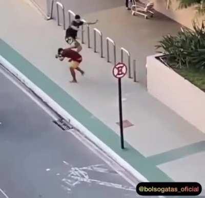 Robber steal a phone and get ran over by a Car and then punch and kicked by a crowd.