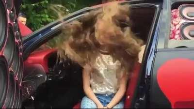 Bass makes her hair vibrate to the music