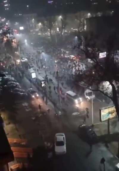 The Russian army in armored personnel carriers are chased away by the Kazakh population in the city of Almaty.