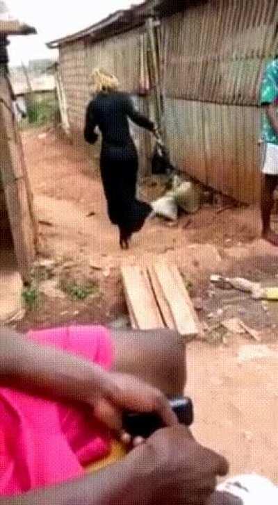 WCGW walking in high heels on a mud path