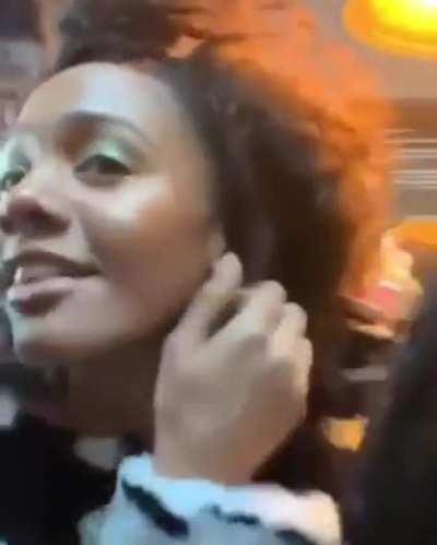 Using an earring that's also a lighter.