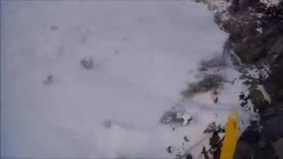 Skier accidentally skis off cliff