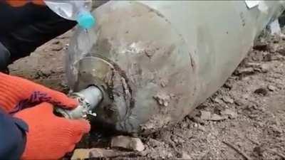 Removing the fuse of a undetonated Russian artillery