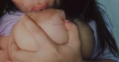 Trying to suck my big boobiess