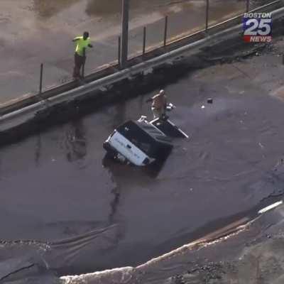 Guy thinks driving through a puddle on the road is a good idea.
