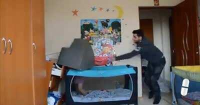 Silly baby can't get enough TV and thinks this is the best way to get more.