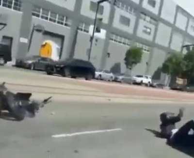 Popping wheelies on the streets in close proximity to others.