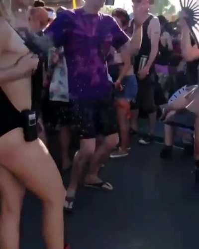 Girl sprays breast milk on people at a festival