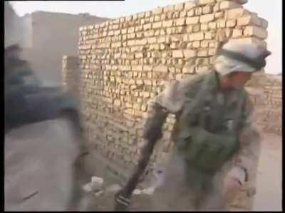 US Marines participating in Operation Phantom Fury are stuck on a rooftop of an insurgent infested building and trade small arms fire and insults as they search for a safe way off the roof.
